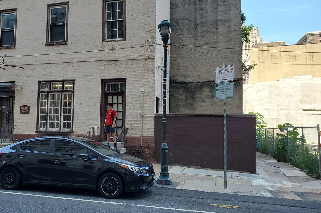 Me, standing on top of a set of stairs, looking to the left